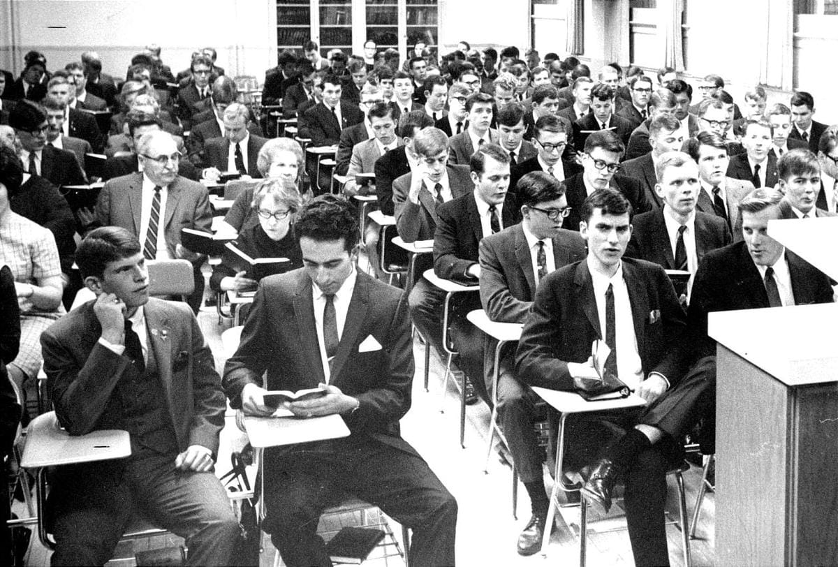 A classroom with dozens of missionary students sitting at desks